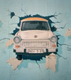 Trabant busting out of the Berlin Wall.