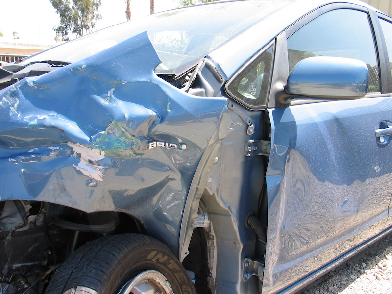 The paint scrape again; the dents in the driver's side door came after the accident, when a CHP cruiser used its front bumper to push the car from the carpool lane to the right shoulder.